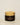 Sports balm jar with wooden lid on a light background